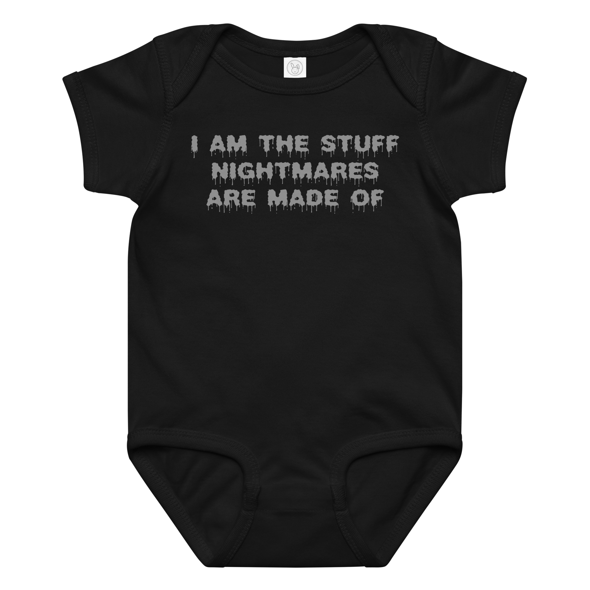 "I am the stuff nightmares are made of" printed on a black baby jersey bodysuit laying on a flat surface amongst other clothes