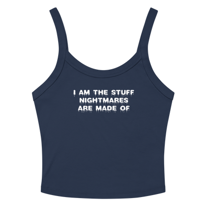 "I am the stuff nightmares are made of" printed on a solid navy blend women's micro-rib tanktop laying on a flat surface amongst sunglasses and shorts
