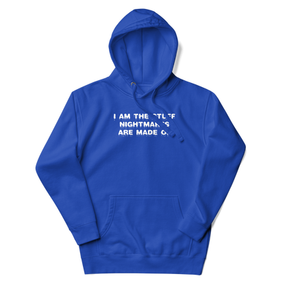 "I am the stuff nightmares are made of" printed on a team royal unisex hoodie laying on a flat surface with the hood up