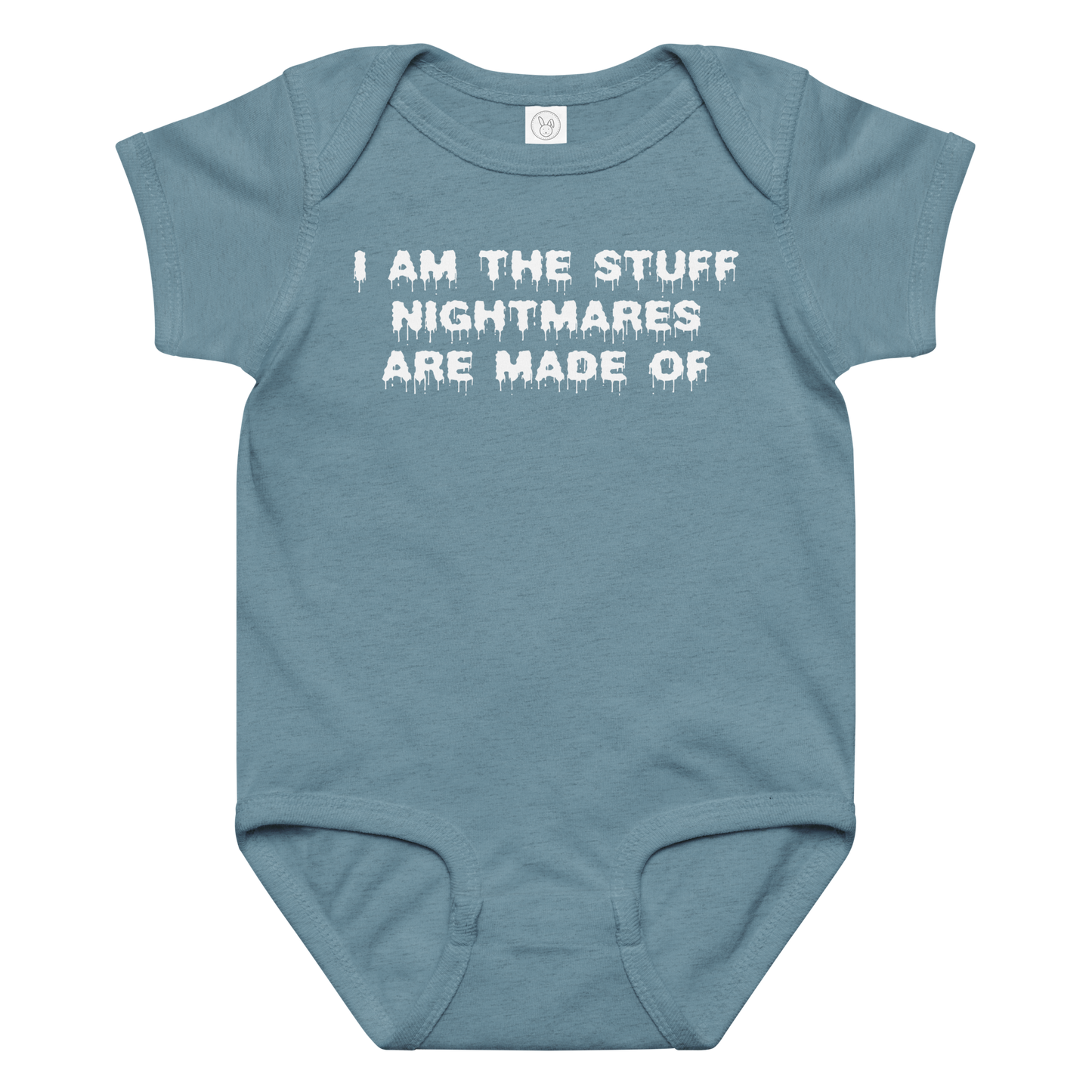 "I am the stuff nightmares are made of" printed on a vintage indigo baby jersey bodysuit laying on a flat surface amongst other clothes