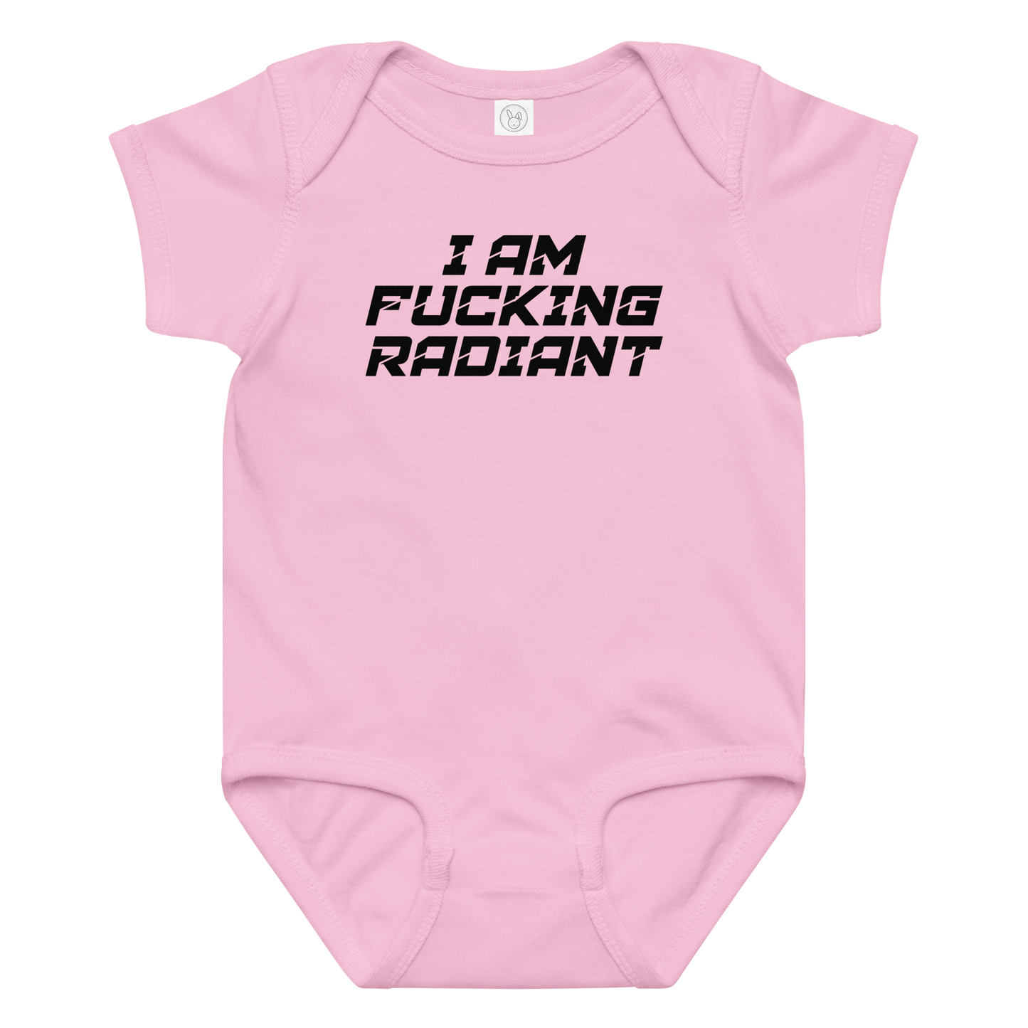"I Am Fucking Radiant" printed on a pink baby jersey bodysuit laying on a flat surface amongst other clothes