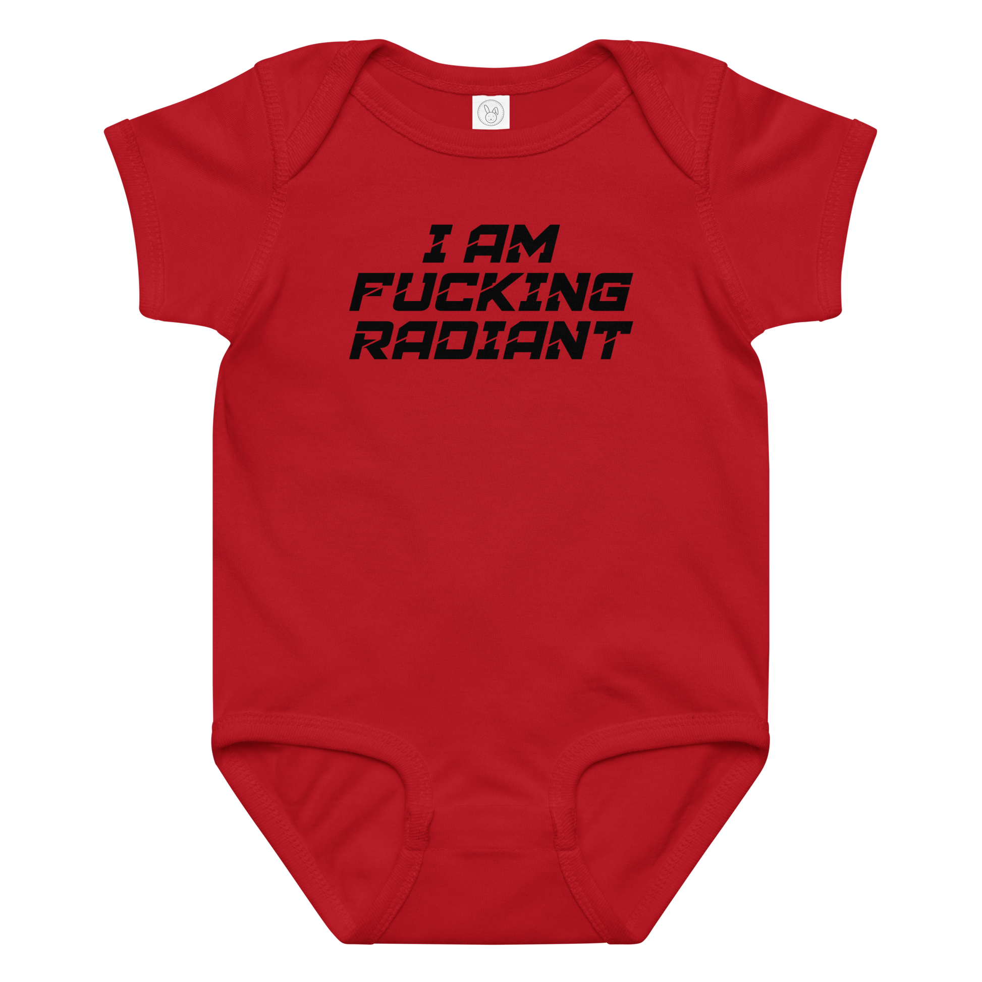 "I Am Fucking Radiant" printed on a red baby jersey bodysuit laying on a flat surface amongst other clothes