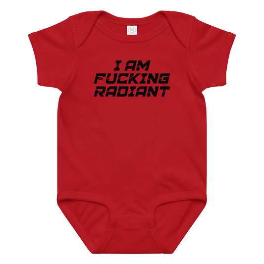 "I Am Fucking Radiant" printed on a red baby jersey bodysuit laying on a flat surface amongst other clothes