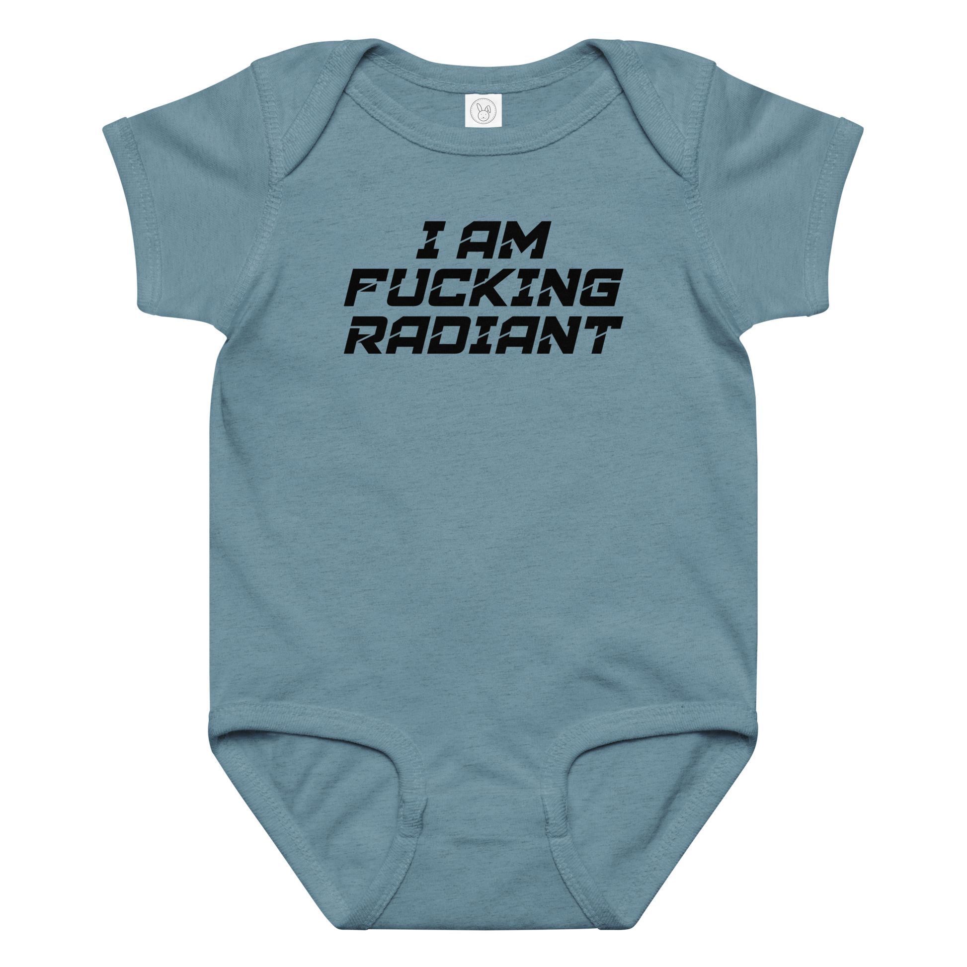 "I Am Fucking Radiant" printed on a vintage indigo baby jersey bodysuit laying on a flat surface amongst other clothes