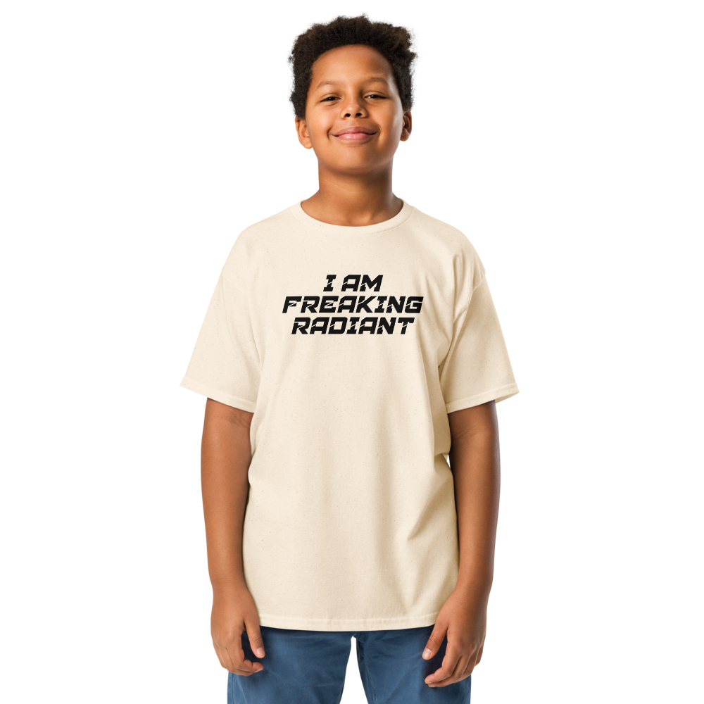 "I Am Freaking Radiant" printed on a natural youth classic tee worn by a male