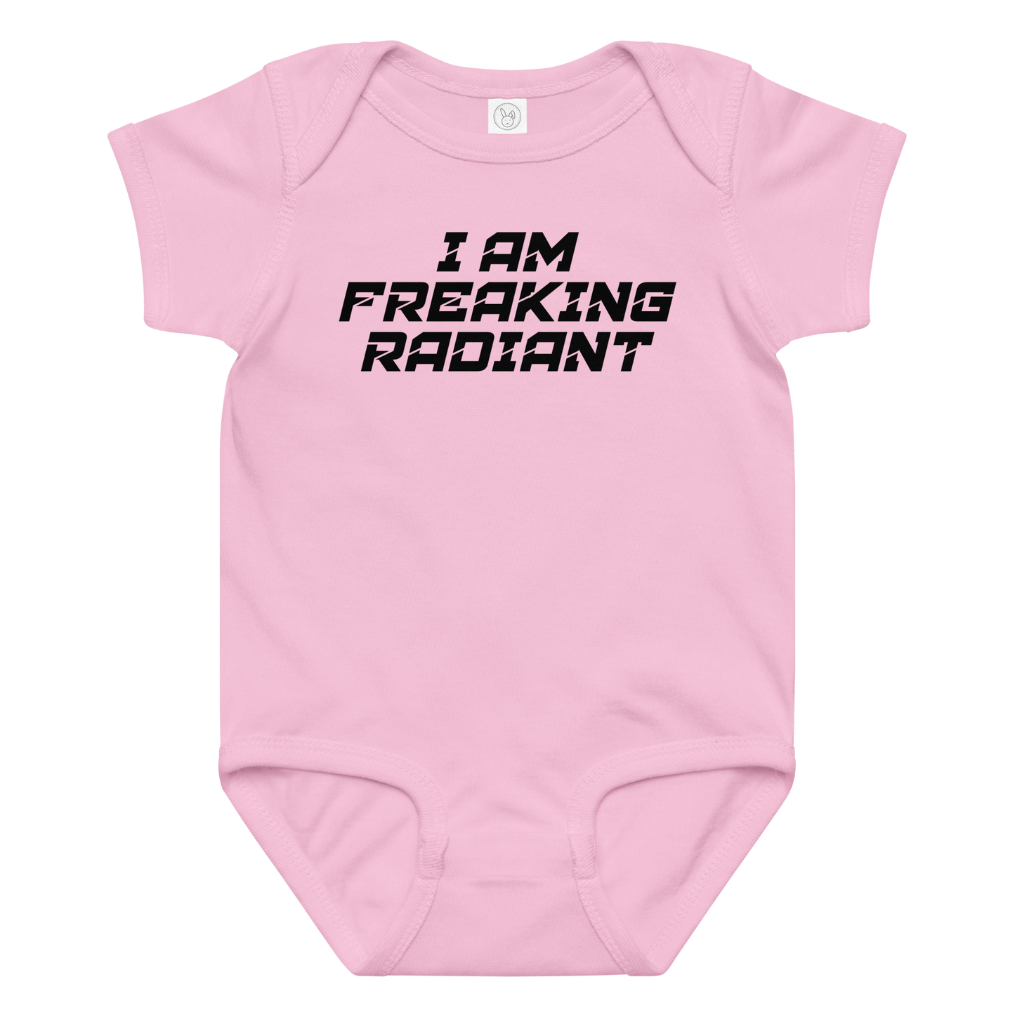"I Am Freaking Radiant" printed on a pink baby jersey bodysuit laying on a flat surface amongst other clothes