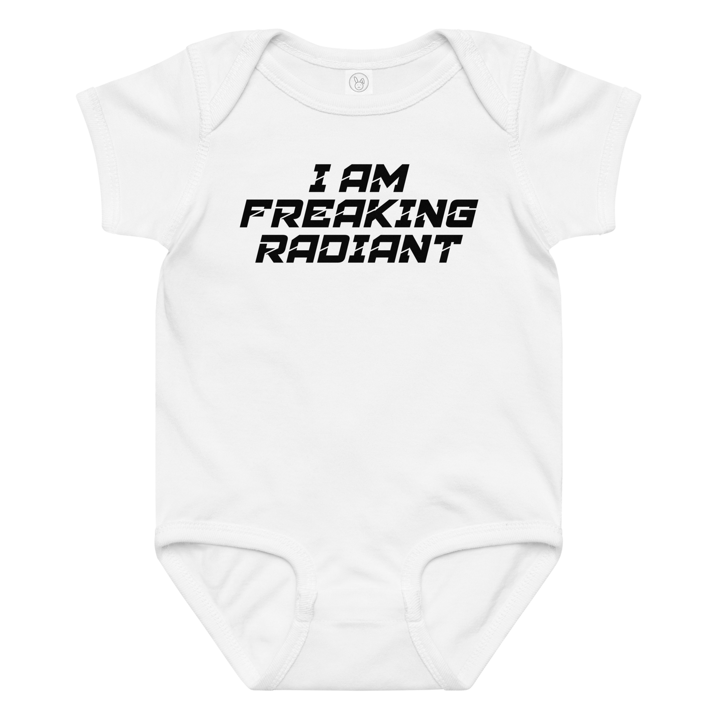 "I Am Freaking Radiant" printed on a white baby jersey bodysuit laying on a flat surface amongst other clothes