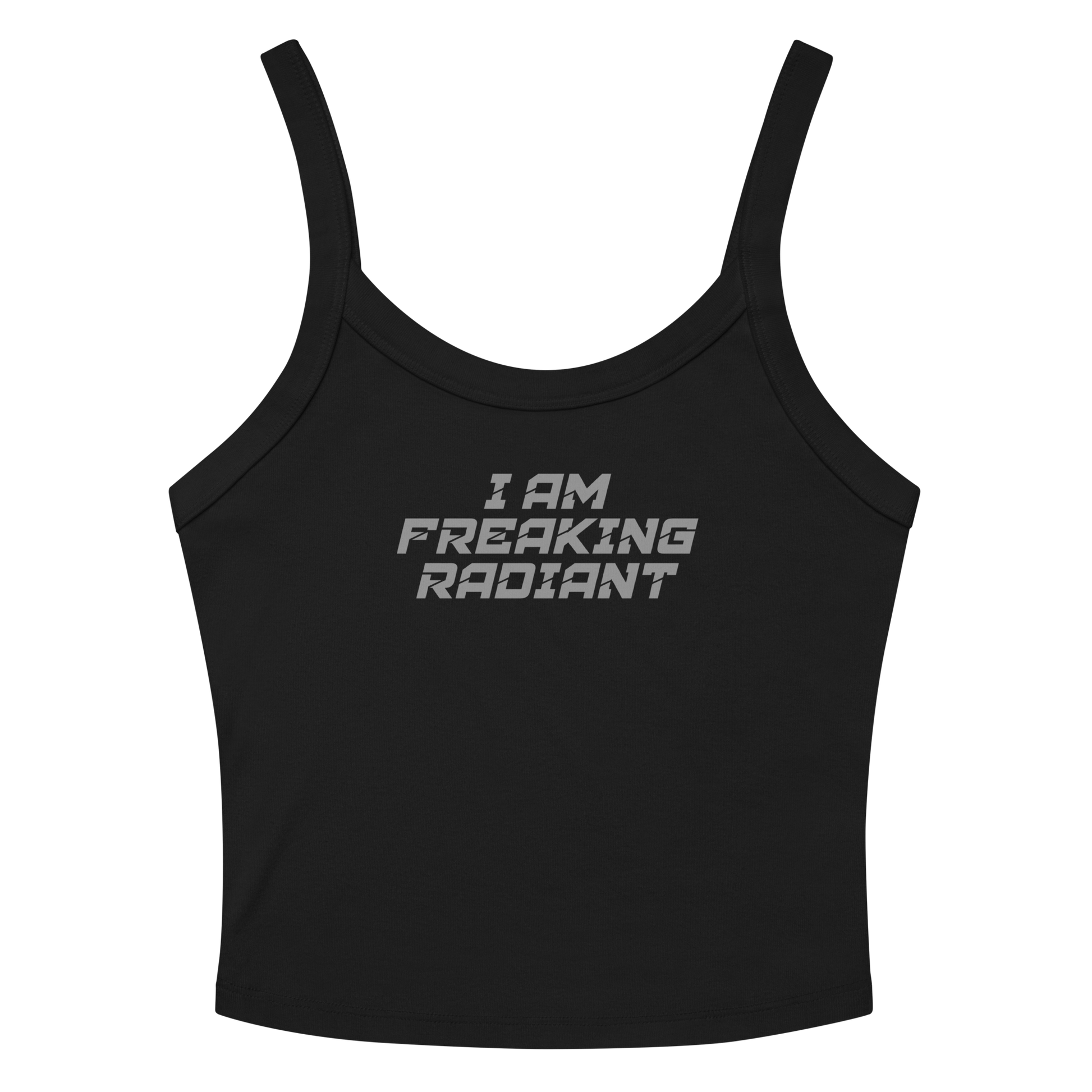 "I Am Freaking Radiant" printed on a solid black blend women's micro-rib tanktop laying on a flat surface amongst sunglasses and shorts