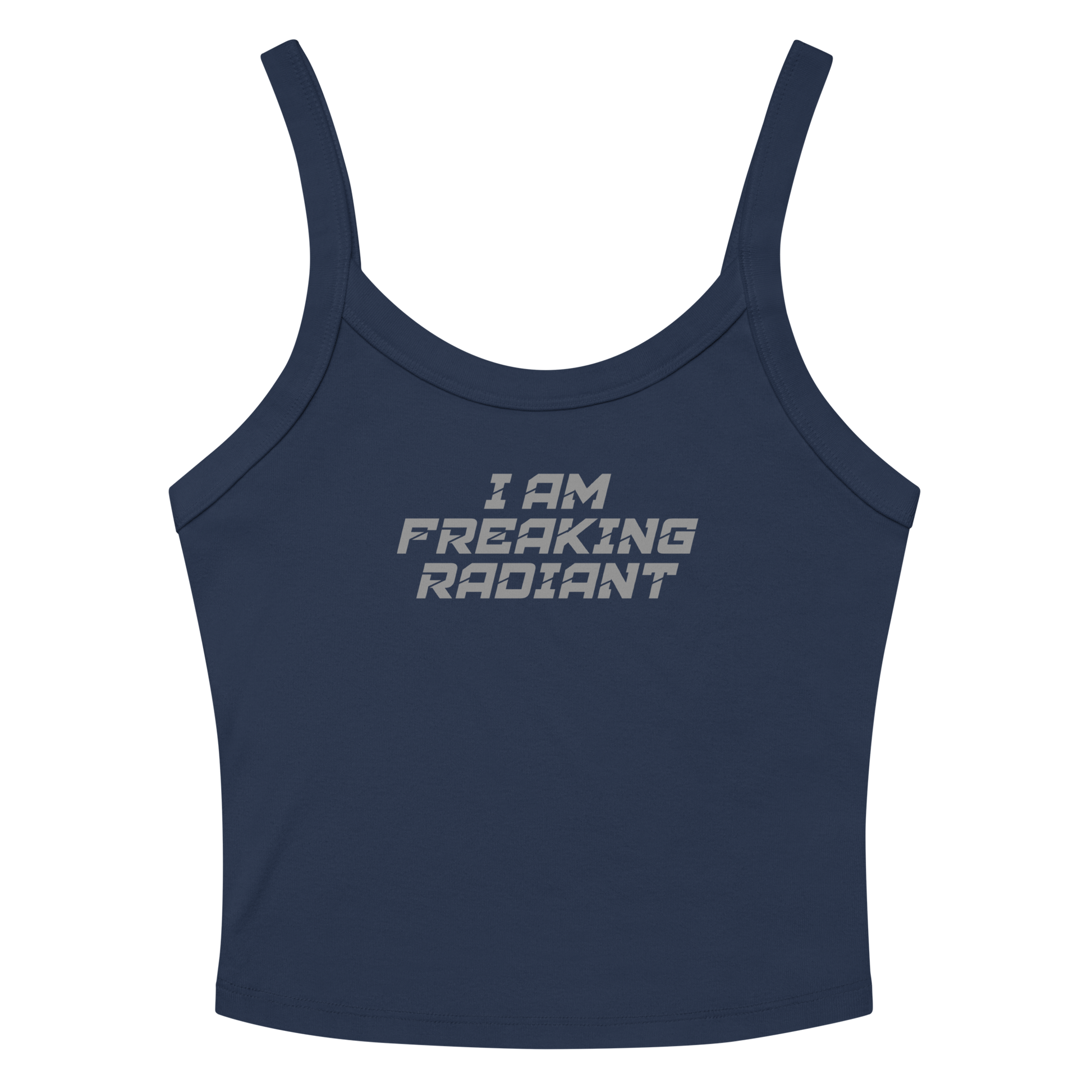 "I Am Freaking Radiant" printed on a solid navy blend women's micro-rib tanktop laying on a flat surface amongst sunglasses and shorts