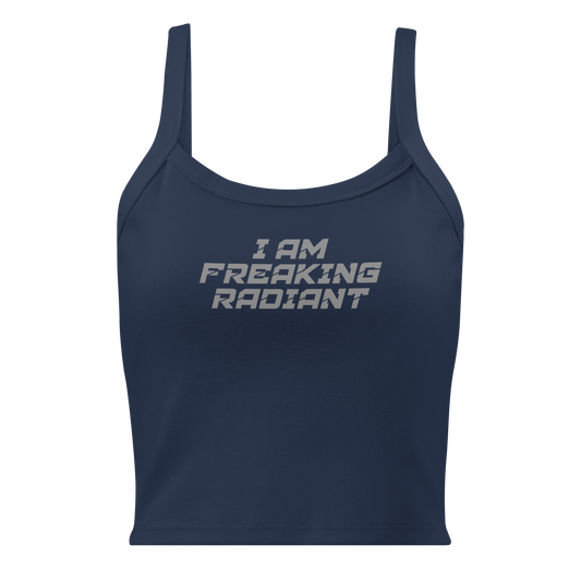 "I Am Freaking Radiant" printed on a solid navy blend women's micro-rib tanktop laying on a flat surface