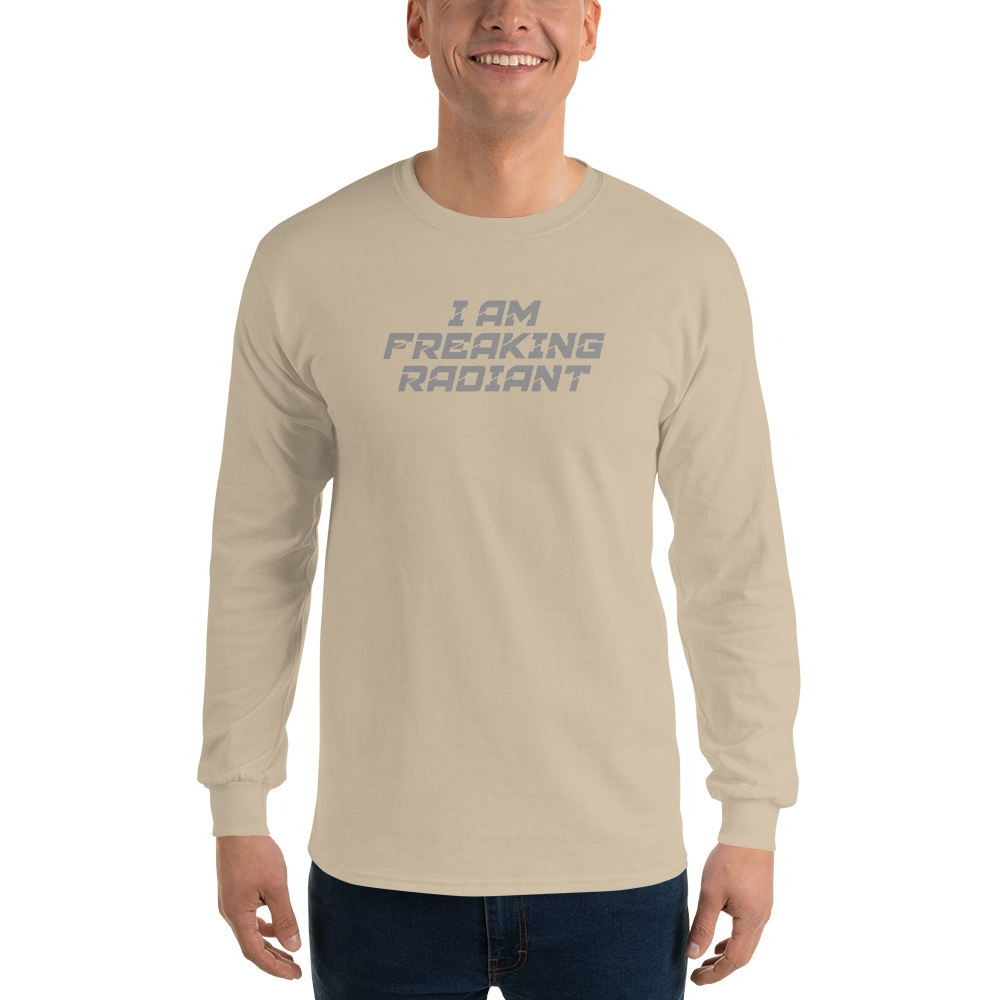 "I Am Freaking Radiant" printed on a sand men's long sleeve shirt worn by a male