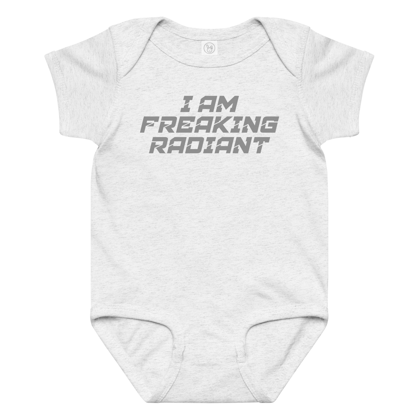 "I Am Freaking Radiant" printed on a ash baby jersey bodysuit laying on a flat surface amongst other clothes
