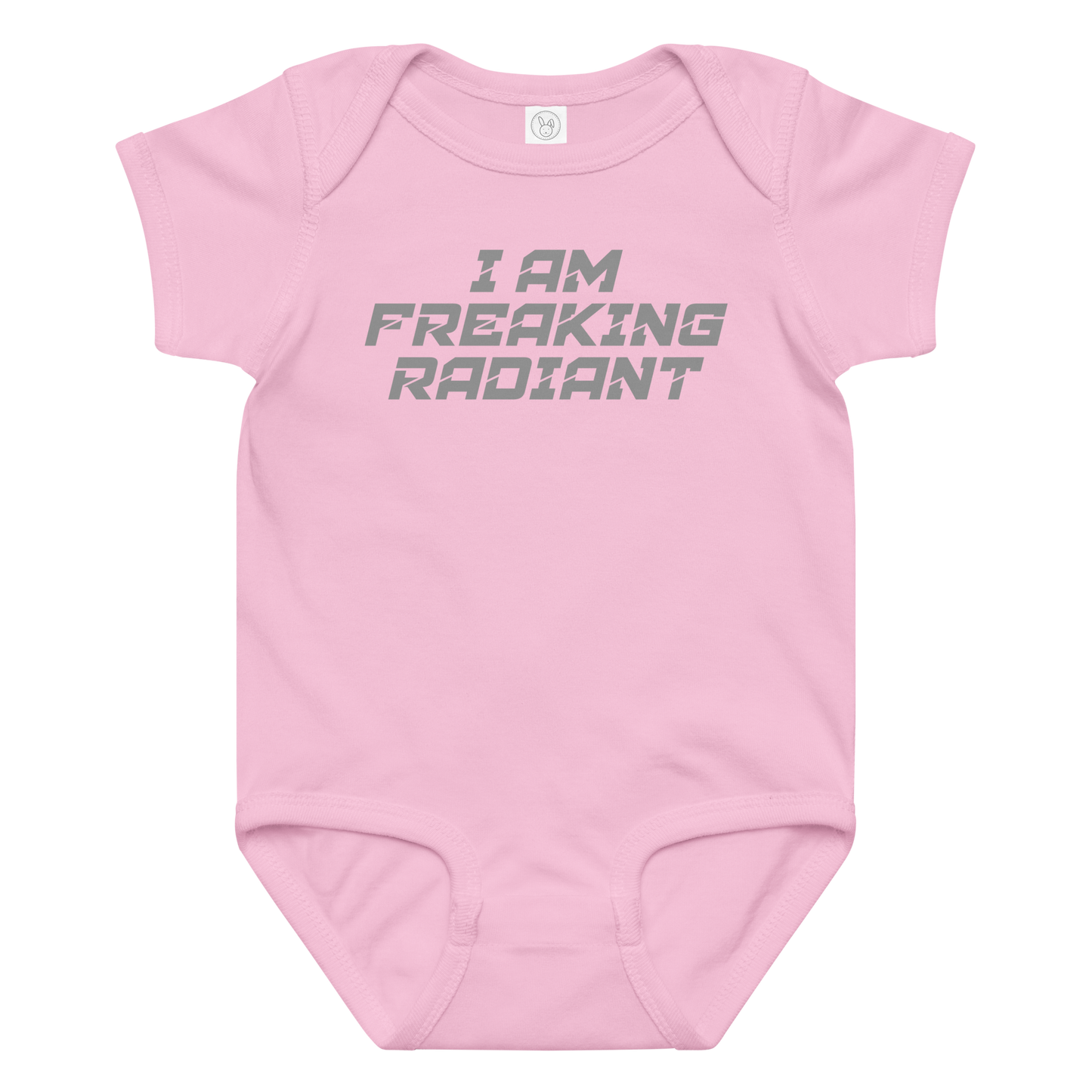 "I Am Freaking Radiant" printed on a pink baby jersey bodysuit laying on a flat surface amongst other clothes