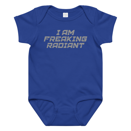 "I Am Freaking Radiant" printed on a royal baby jersey bodysuit laying on a flat surface amongst other clothes
