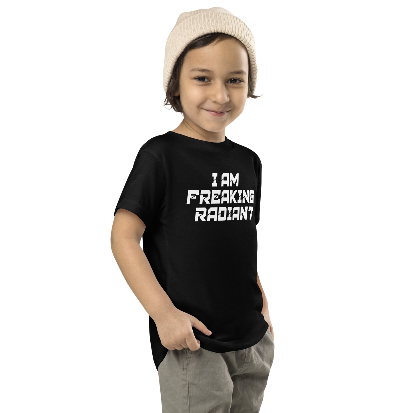 "I Am Freaking Radiant" printed on a black toddler short sleeve tee worn by a male who is also wearing a knit cap