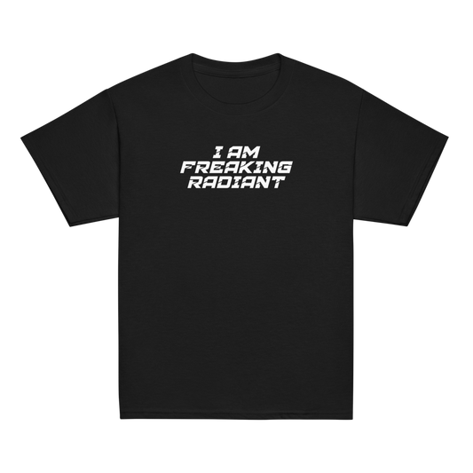 "I Am Freaking Radiant" printed on a black youth classic tee laying on a flat surface