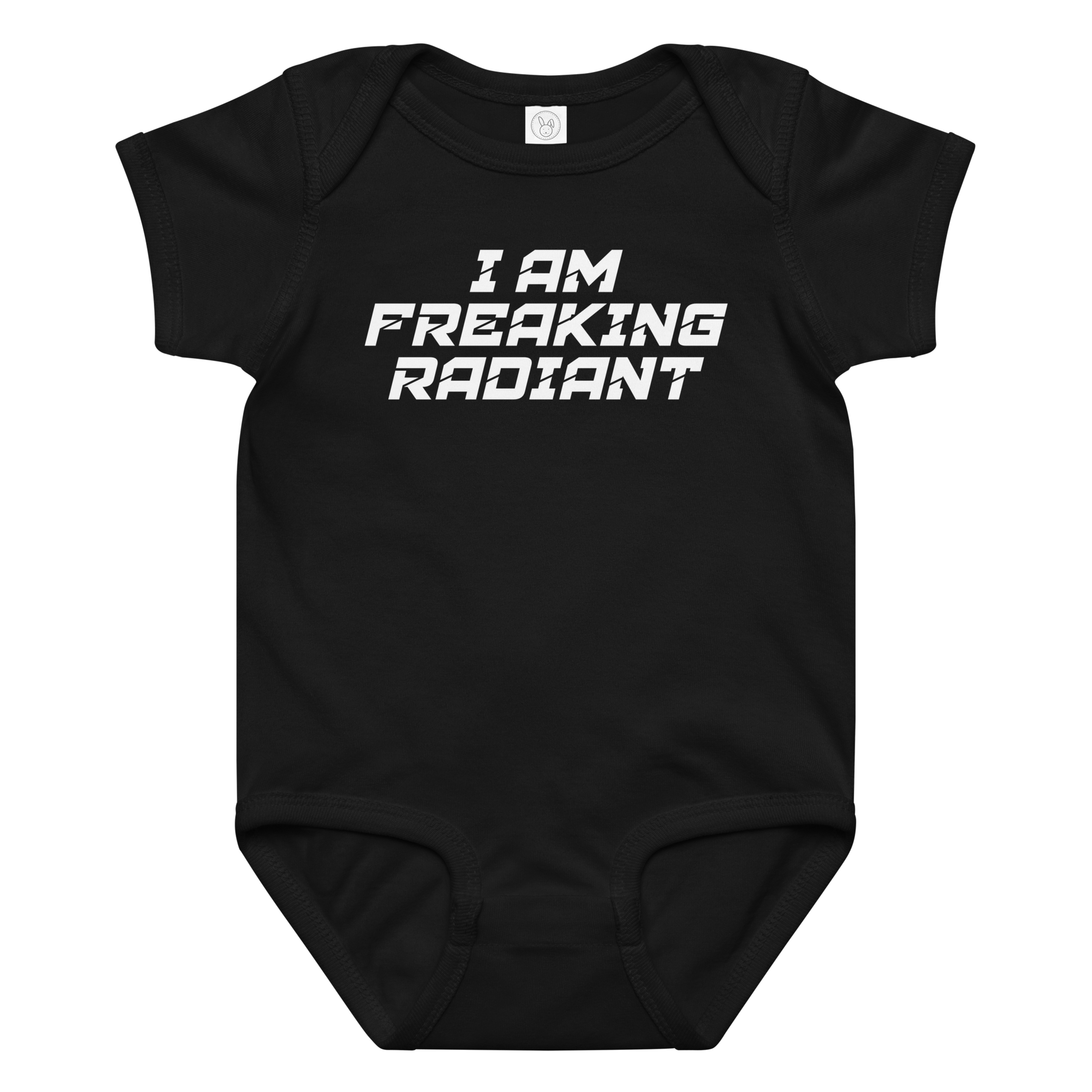 "I Am Freaking Radiant" printed on a black baby jersey bodysuit laying on a flat surface amongst other clothes