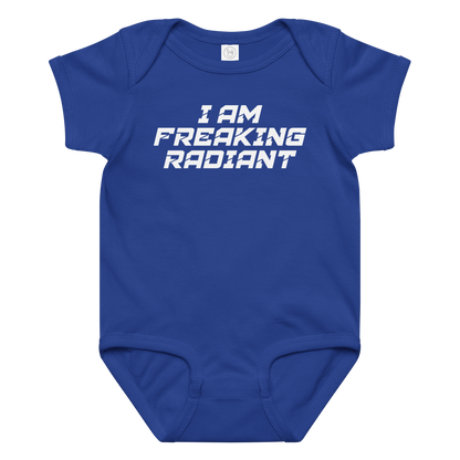 "I Am Freaking Radiant" printed on a royal baby jersey bodysuit laying on a flat surface amongst other clothes