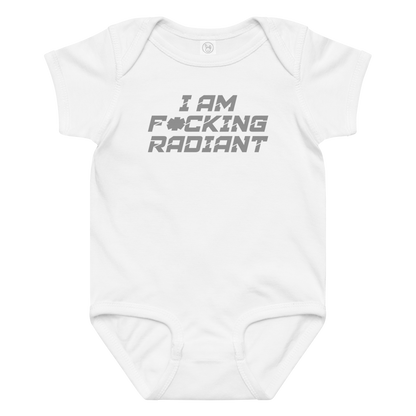 "I Am F*cking Radiant" printed on a white baby jersey bodysuit laying on a flat surface amongst other clothes