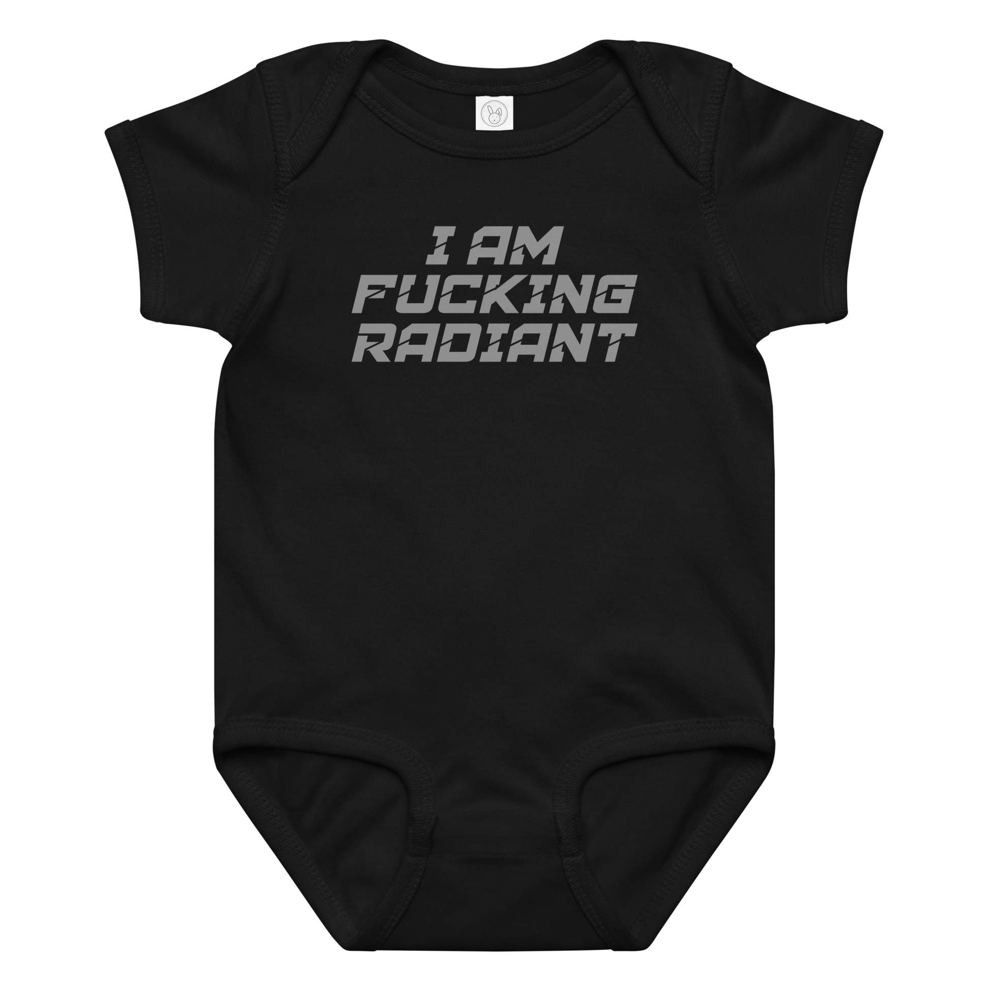 "I Am Fucking Radiant" printed on a black baby jersey bodysuit laying on a flat surface amongst other clothes
