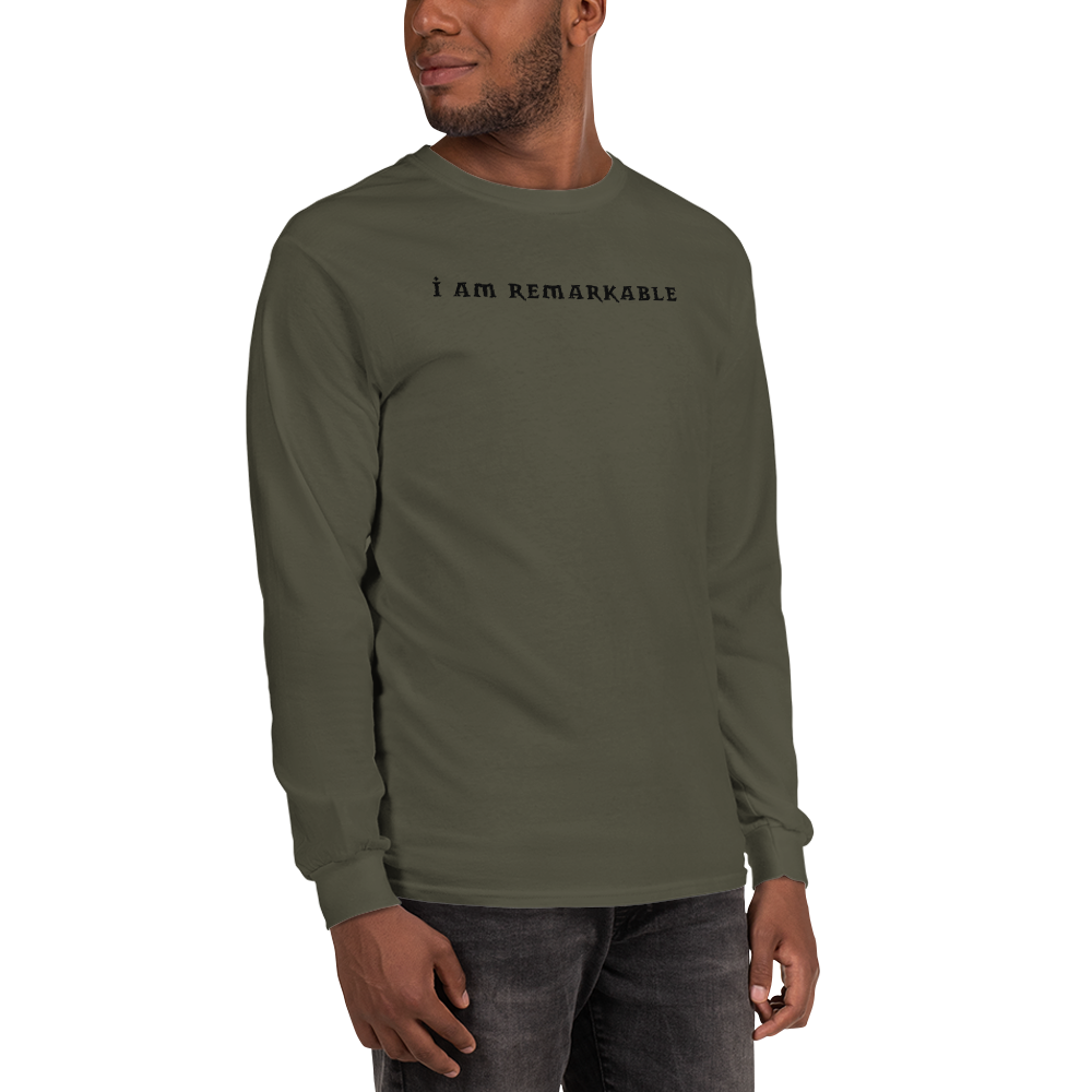 "I am remarkable" printed on a military green men's long sleeve shirt worn by a male