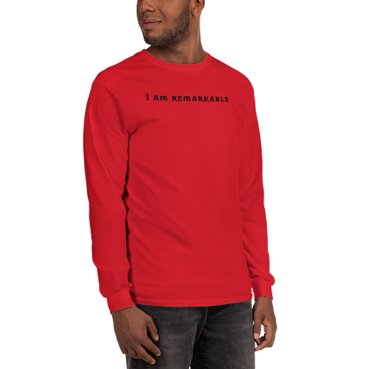 "I am remarkable" printed on a red men's long sleeve shirt worn by a male