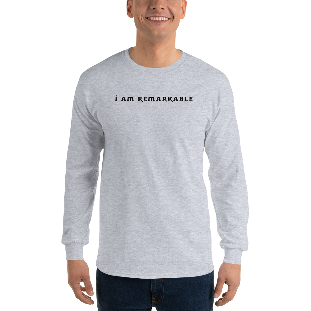 "I am remarkable" printed on a sport grey men's long sleeve shirt worn by a male