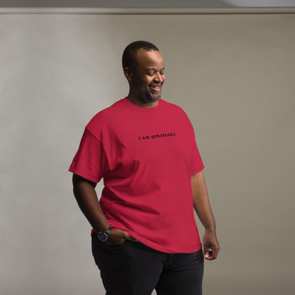 "I am remarkable" printed on a cardinal unisex classic tee worn by a male
