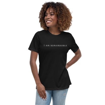 "I am remarkable" printed on a black women's relaxed t-shirt worn by a female