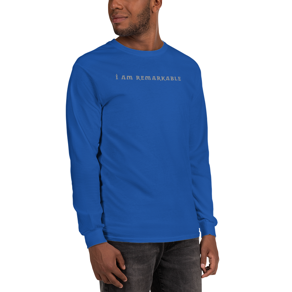 "I am remarkable" printed on a royal men's long sleeve shirt worn by a male