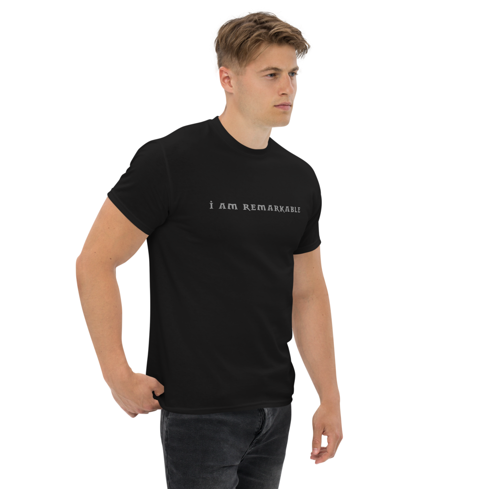 "I am remarkable" printed on a black unisex classic tee worn by a male