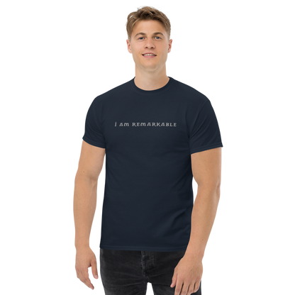 "I am remarkable" printed on a navy unisex classic tee worn by a male