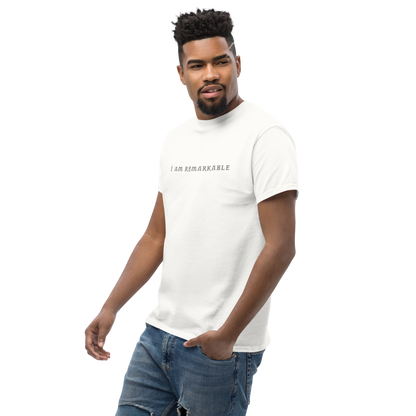 "I am remarkable" printed on a white unisex classic tee worn by a male