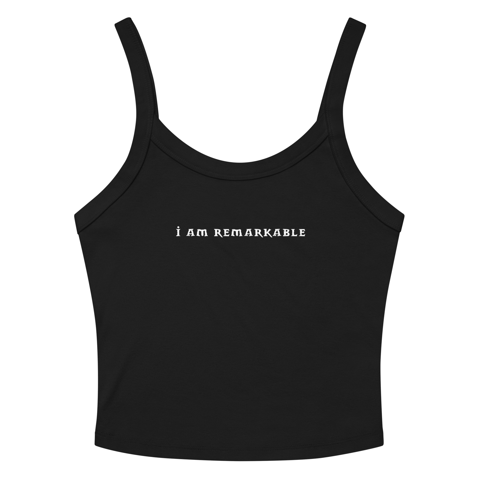 "I am remarkable" printed on a solid black blend women's micro-rib tanktop laying on a flat surface amongst sunglasses and shorts