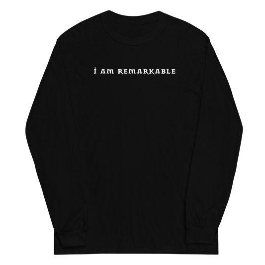 "I am remarkable" printed on a black men's long sleeve shirt laying on a flat surface