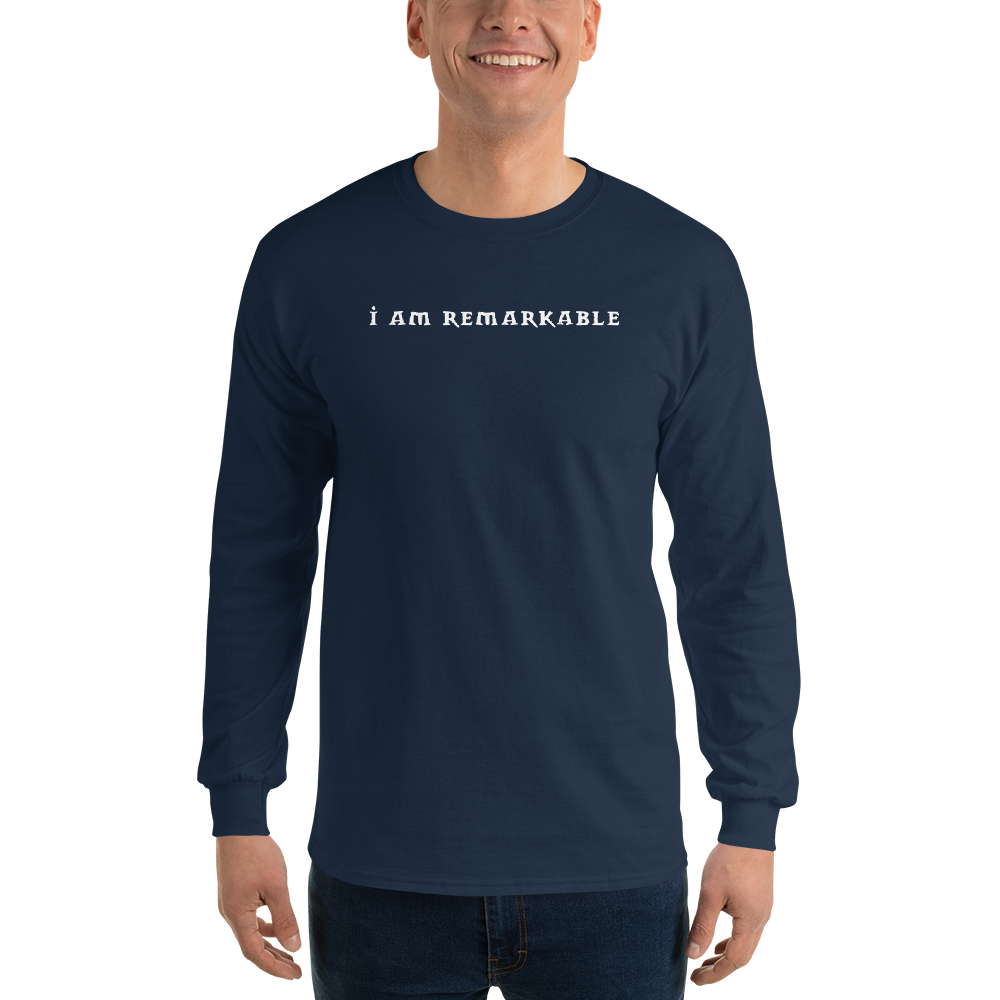 "I am remarkable" printed on a navy men's long sleeve shirt worn by a male