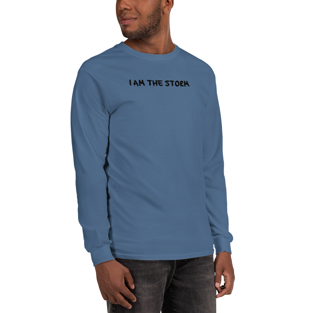 "I am the storm" printed on a indigo blue men's long sleeve shirt worn by a male
