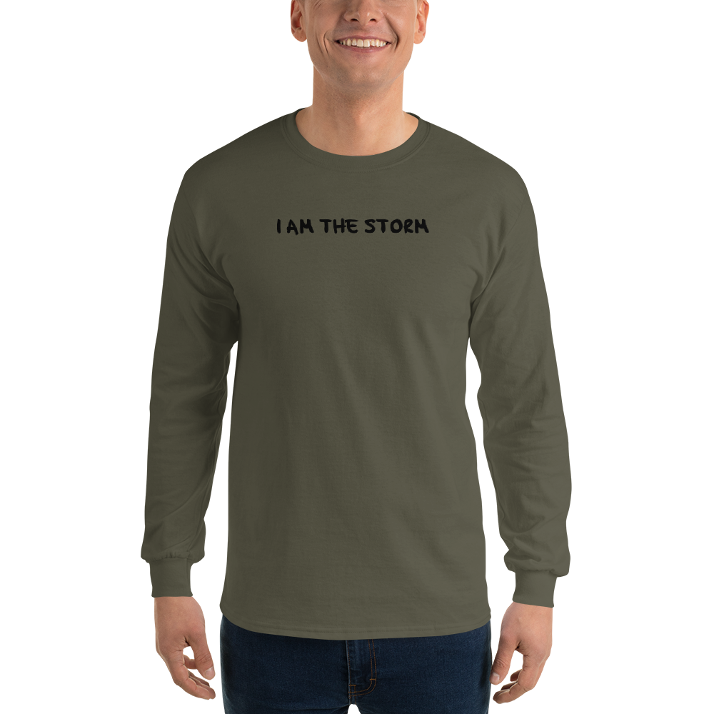 "I am the storm" printed on a military green men's long sleeve shirt worn by a male