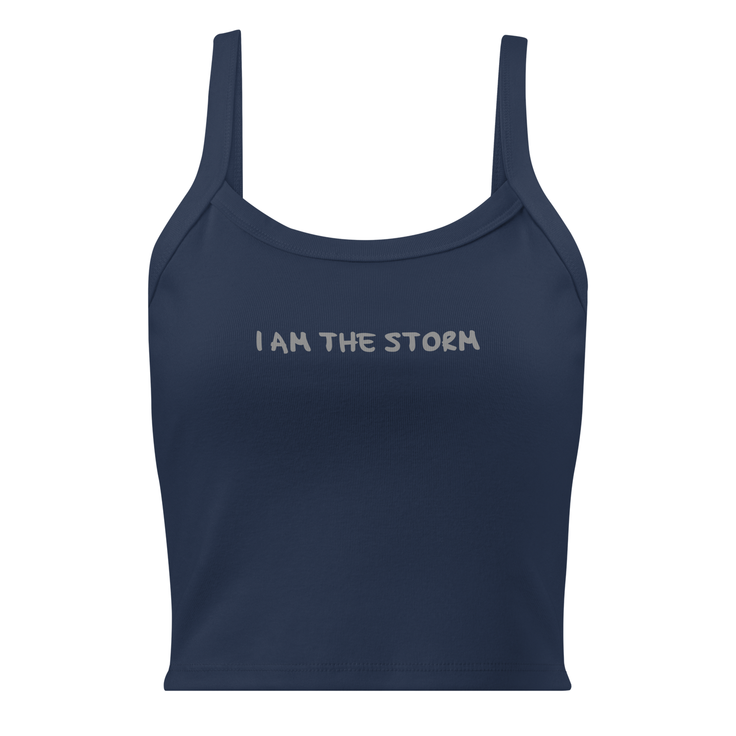 "I am the storm" printed on a solid navy blend women's micro-rib tanktop laying on a flat surface