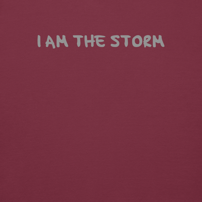 "I am the storm" printed on a maroon background