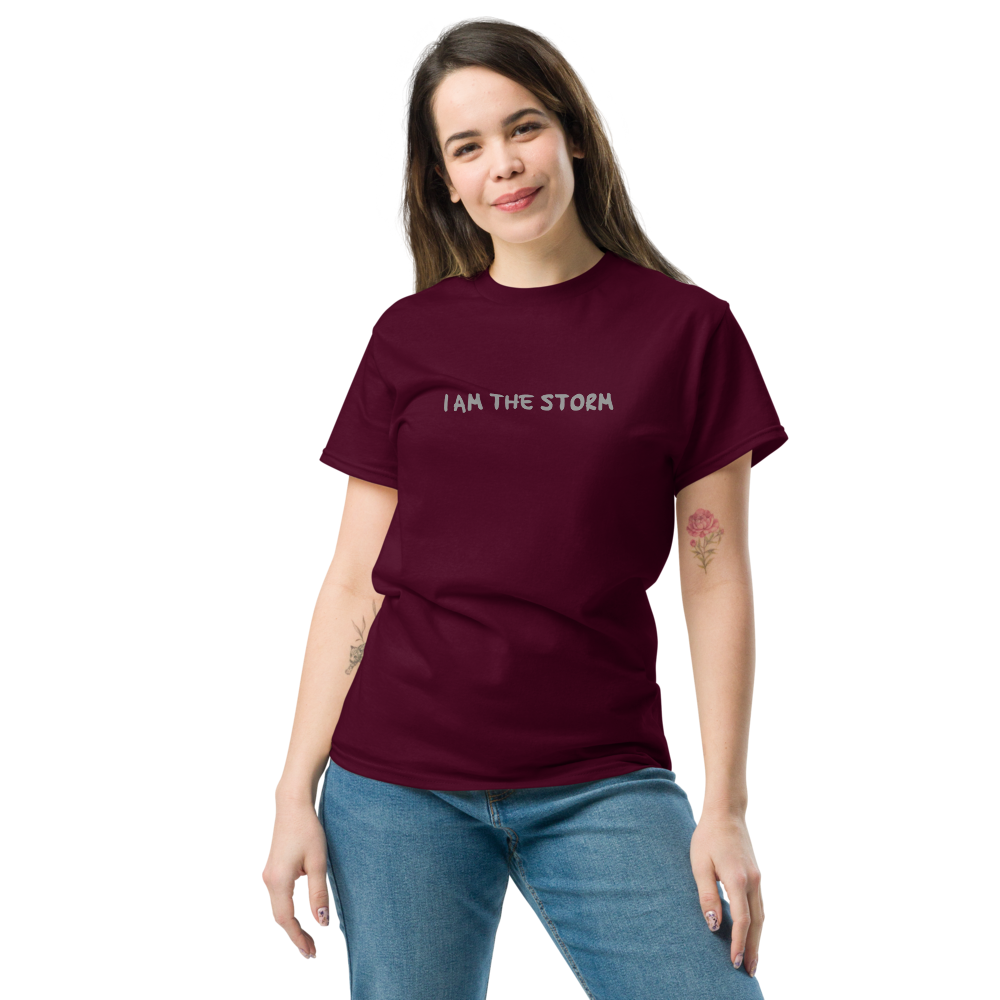 "I am the storm" printed on a maroon unisex classic tee worn by a female