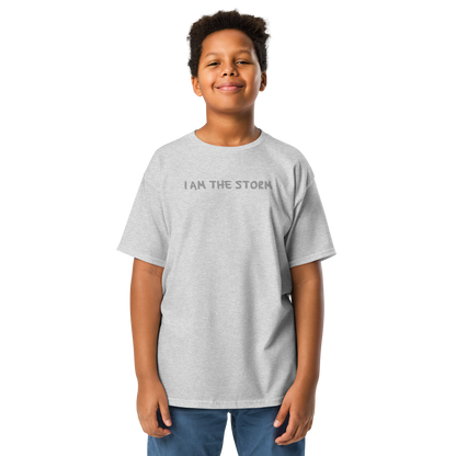 "I am the storm" printed on a sport grey youth classic tee worn by a male