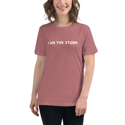"I am the storm" printed on a heather mauve women's relaxed t-shirt worn by a female