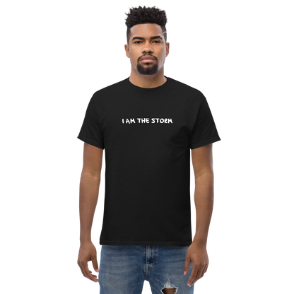 "I am the storm" printed on a black unisex classic tee worn by a male