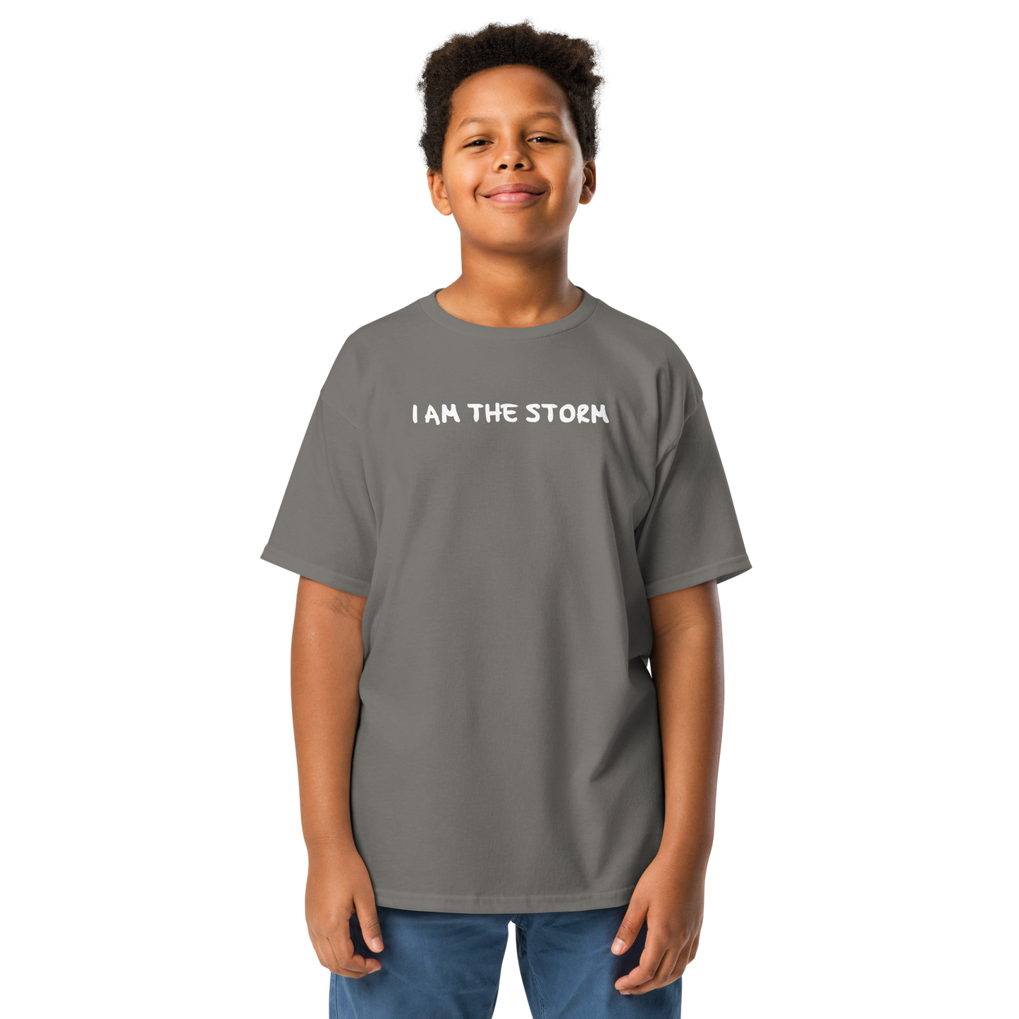"I am the storm" printed on a charcoal youth classic tee worn by a male