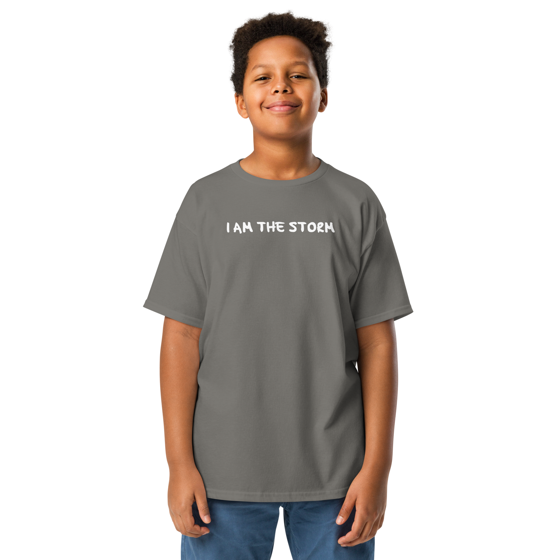 "I am the storm" printed on a charcoal youth classic tee worn by a male