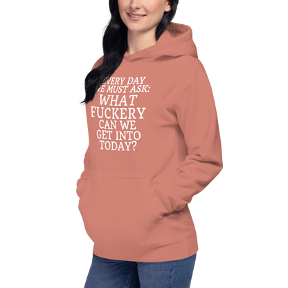 "Every day we must ask: What fuckery can we get into today?" printed on a dusty rose unisex hoodie worn by a female