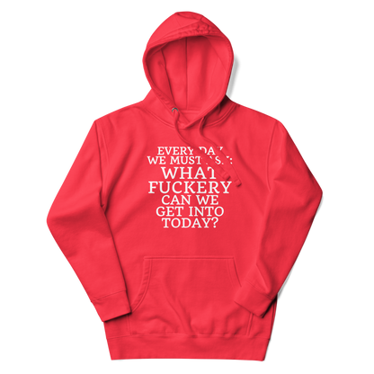 "Every day we must ask: What fuckery can we get into today?" printed on a team red unisex hoodie laying on a flat surface with the hood up