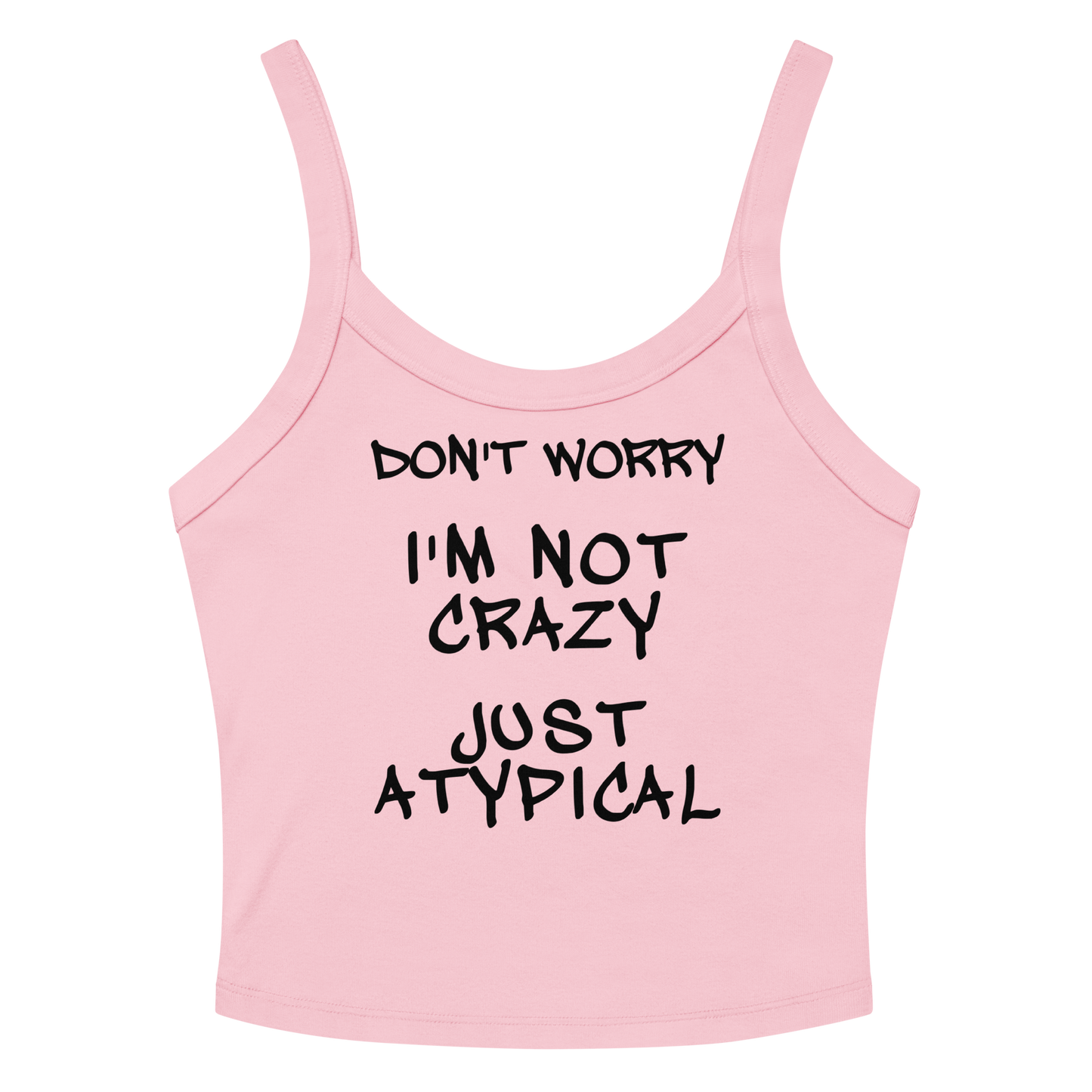 "Don't Worry I'm Not Crazy Just Atypical" printed on a solid pink blend women's micro-rib tanktop laying on a flat surface amongst sunglasses and shorts
