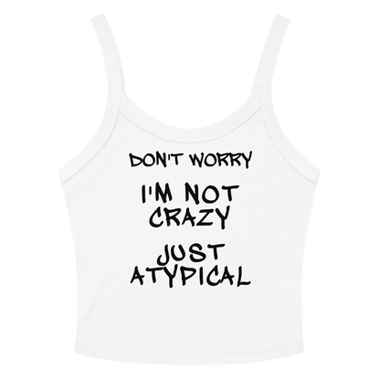 "Don't Worry I'm Not Crazy Just Atypical" printed on a solid white blend women's micro-rib tanktop laying on a flat surface amongst sunglasses and shorts